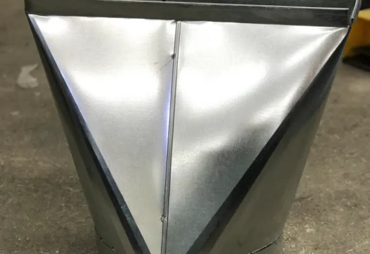 Square-to-round duct fitting fabricated by Norwest